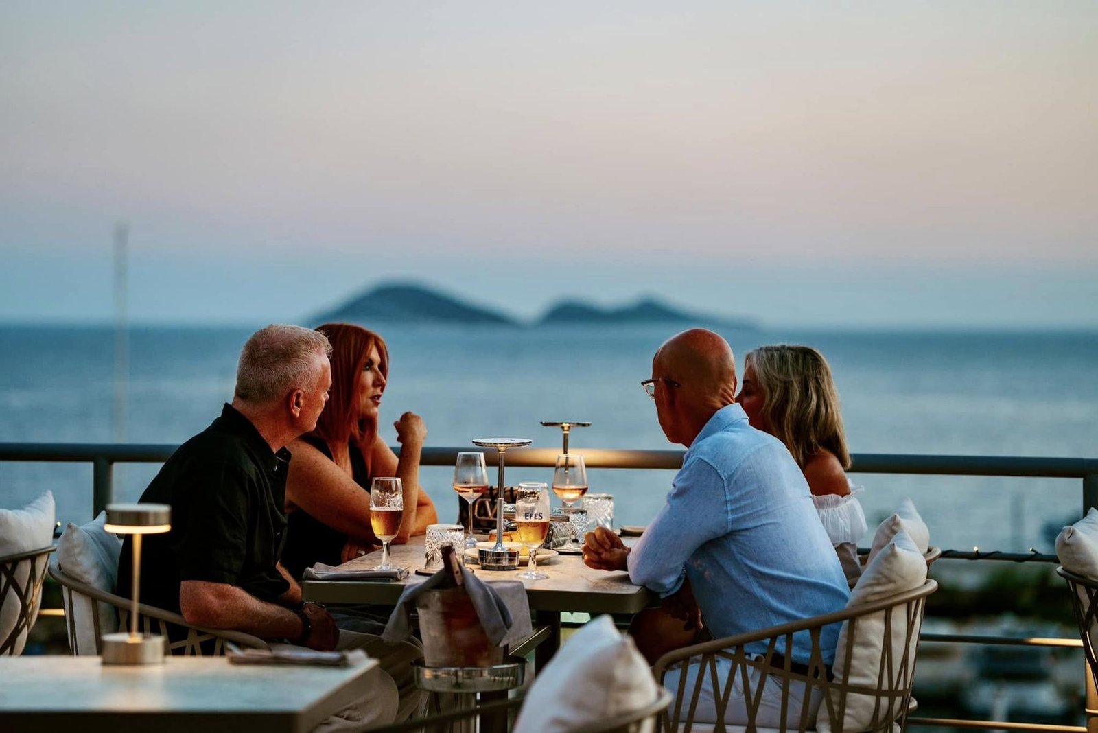 Guests enjoying handmade cocktails on the rooftop bar at Taraça, Kalkan