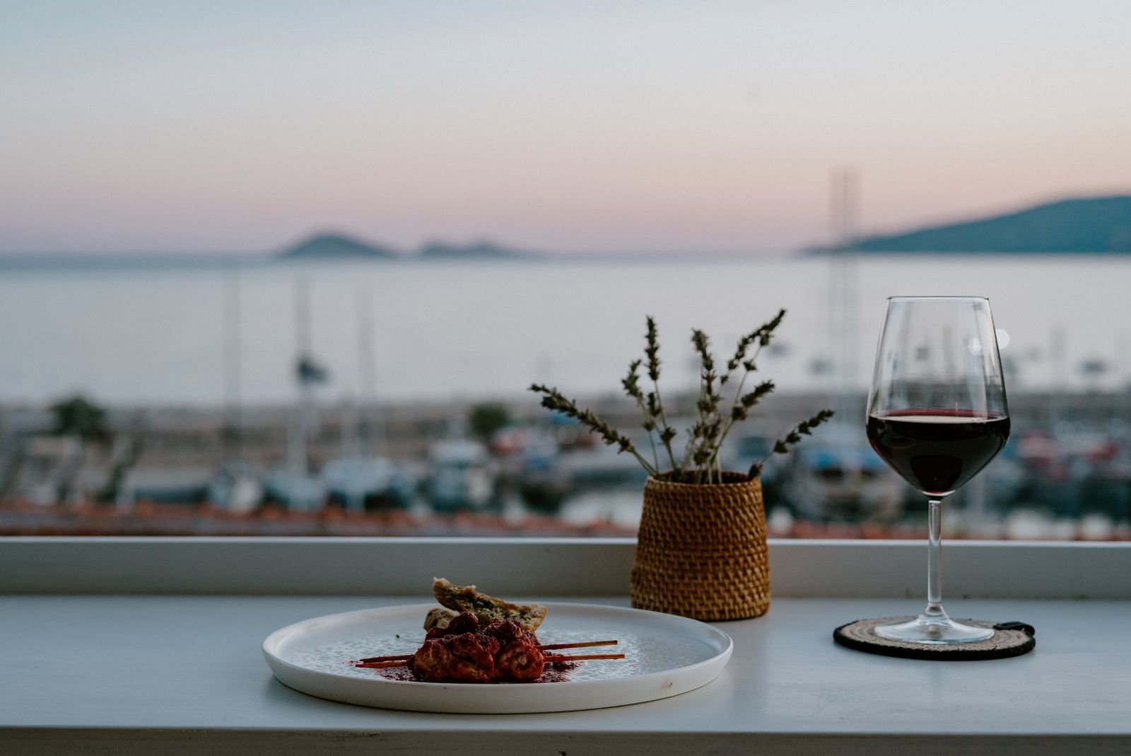Grilled skewers and red wine at sunset on Taraça's rooftop terrace, Kalkan