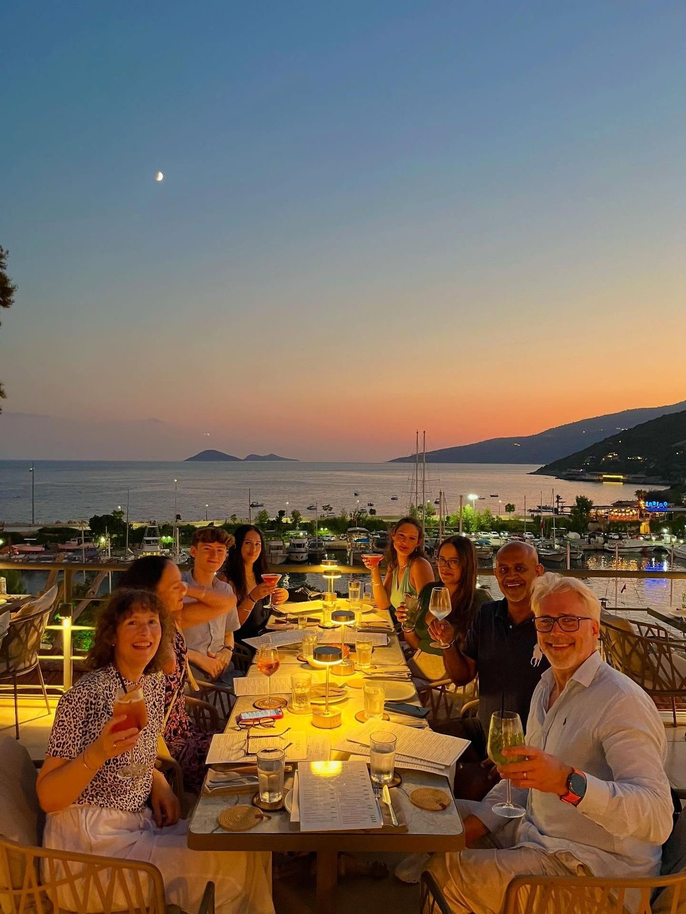 Friends sharing dinner on the rooftop terrace at Taraça Lounge & Kitchen, Kalkan