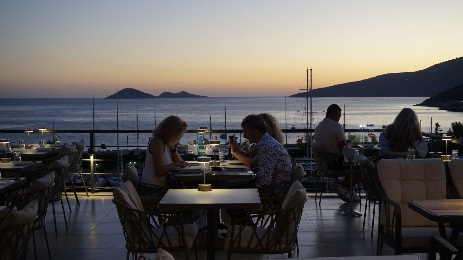 Rooftop terrace at Taraça Lounge & Kitchen at sunset, overlooking Kalkan harbour