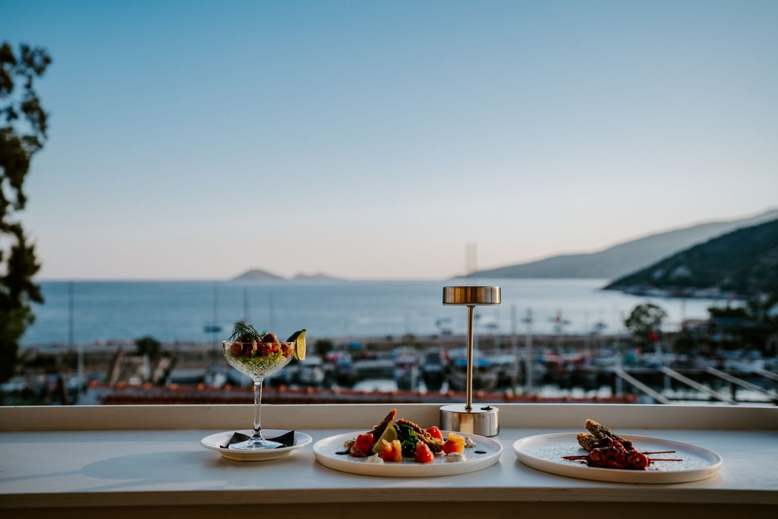 Mediterranean sharing plates and a cocktail with a Kalkan harbour view at Taraça Lounge & Kitchen