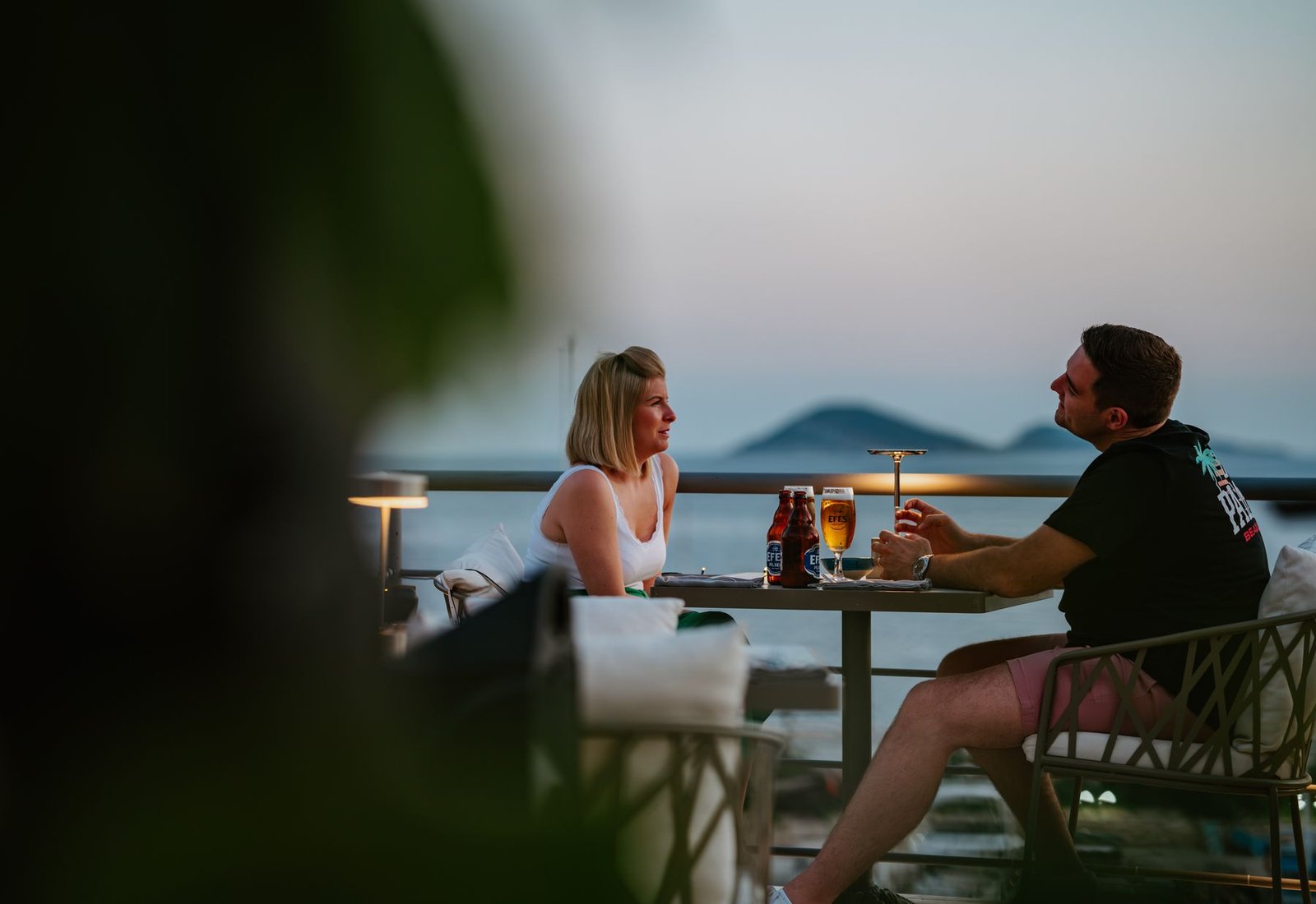 Couple enjoying sunset drinks on Taraça's rooftop terrace overlooking Kalkan harbour